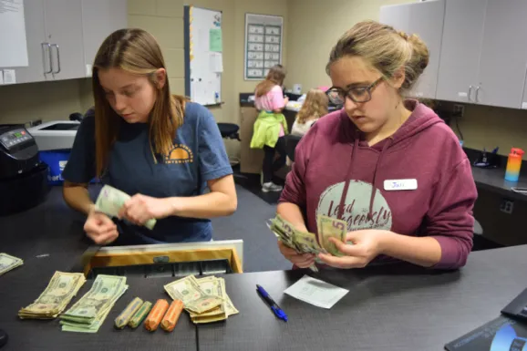 students counting money