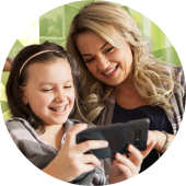 Parent and daughter looking at a blog